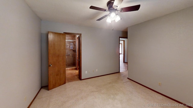 carpeted bedroom with ceiling fan and ensuite bathroom