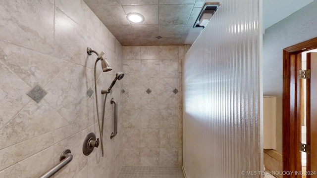 full bathroom with a tile shower