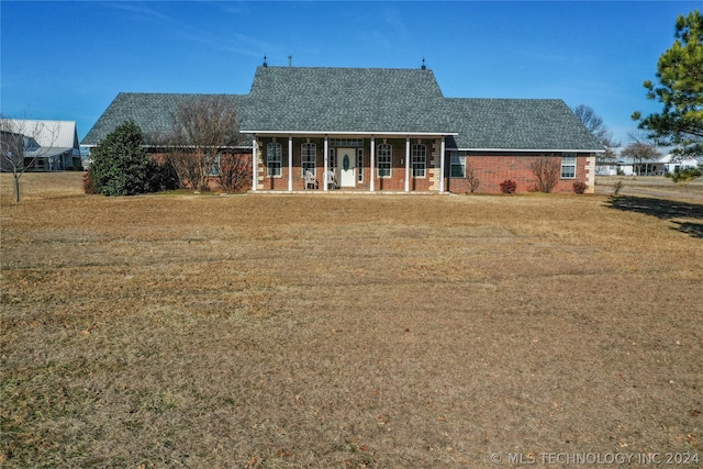 back of house with a lawn