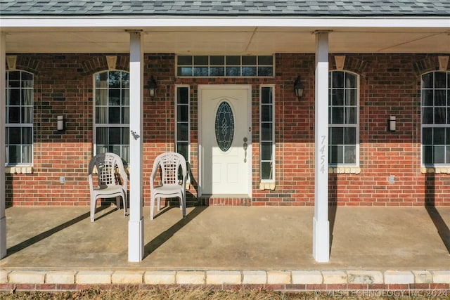 doorway to property featuring covered porch