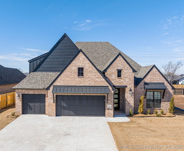 view of front of home with brick siding, fence, and roof with shingles