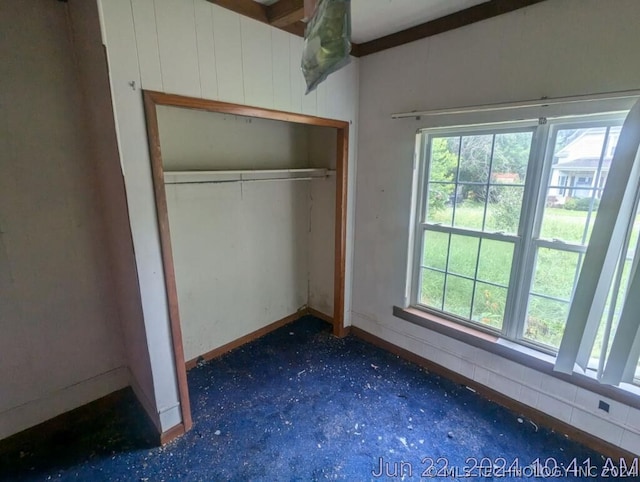 unfurnished bedroom featuring a closet