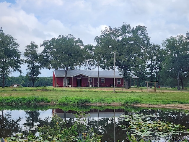 back of property with a yard