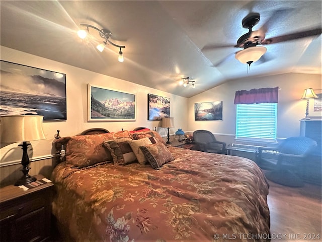 bedroom with ceiling fan and vaulted ceiling