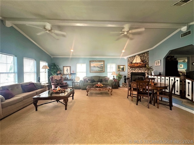 carpeted living room featuring crown molding, a fireplace, lofted ceiling with beams, and ceiling fan