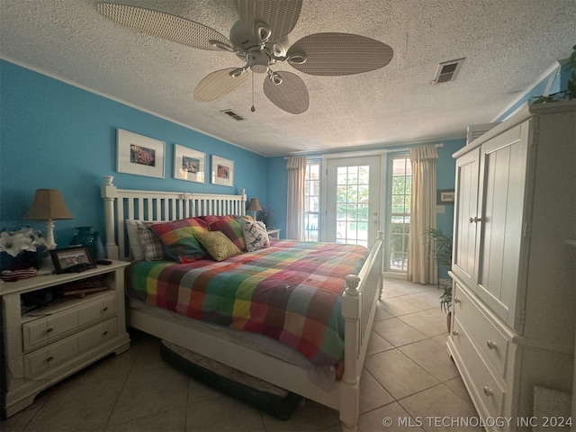 bedroom with light tile patterned flooring, access to exterior, a textured ceiling, and ceiling fan