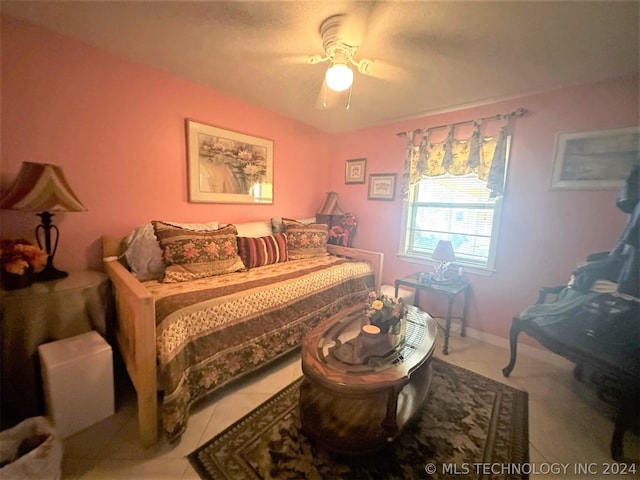 tiled bedroom with ceiling fan