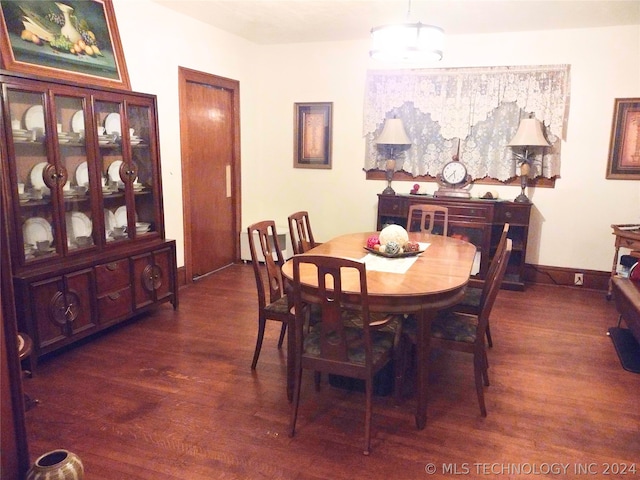 dining area featuring dark hardwood / wood-style flooring