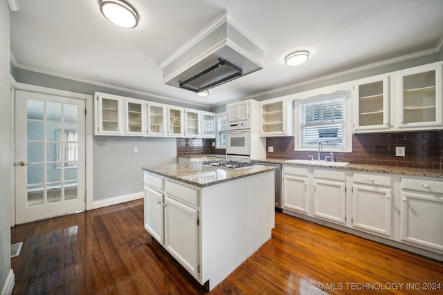 kitchen with light stone counters and white cabinets