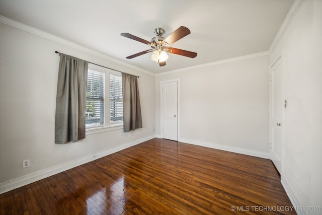 spare room with dark hardwood / wood-style floors, crown molding, and ceiling fan