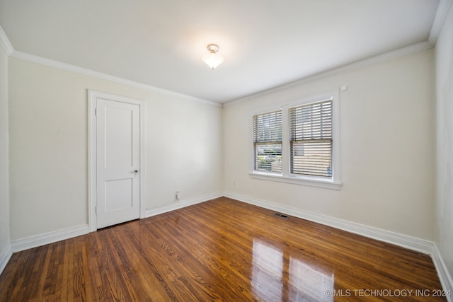 unfurnished room with wood-type flooring and crown molding