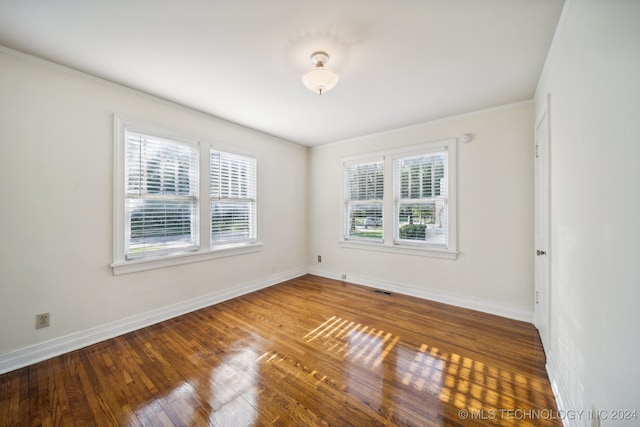 unfurnished room featuring hardwood / wood-style floors