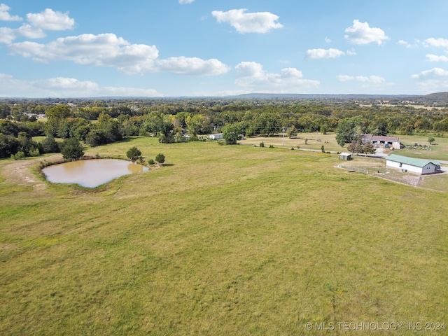 aerial view with a water view and a rural view