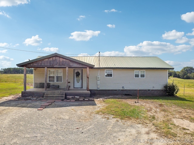 view of front of property with a front yard and covered porch