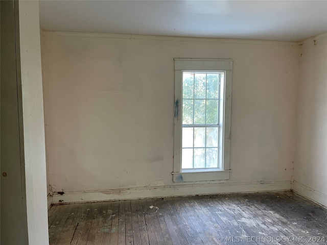 unfurnished room with hardwood / wood-style flooring