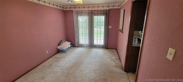 carpeted empty room with a healthy amount of sunlight