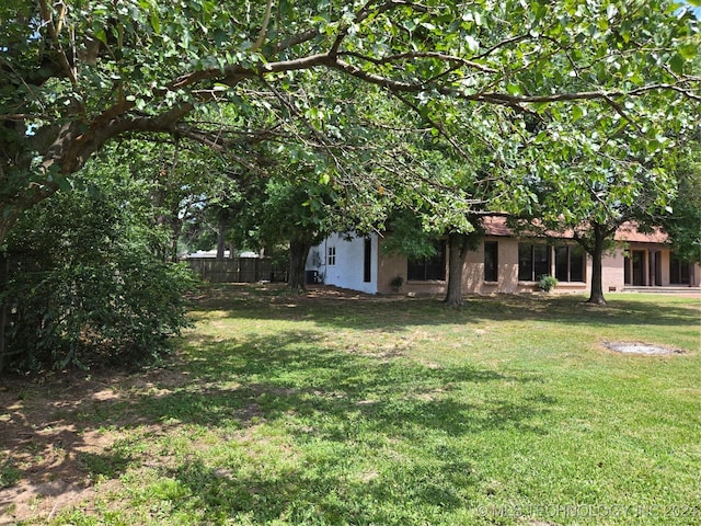 view of yard with fence