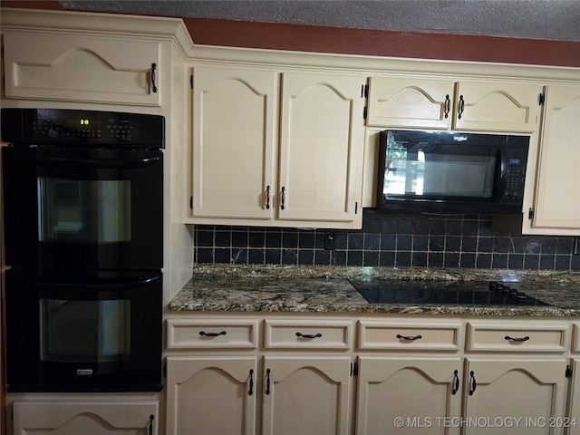 kitchen with black appliances and backsplash