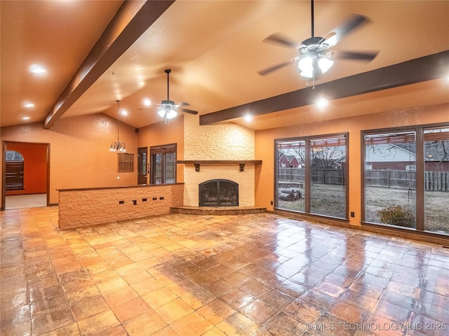 unfurnished living room with a fireplace, lofted ceiling with beams, and ceiling fan