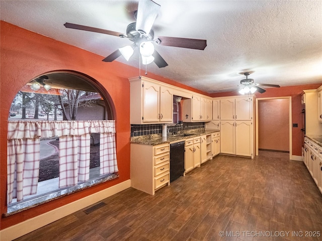 kitchen with a sink, visible vents, dishwasher, tasteful backsplash, and dark wood finished floors