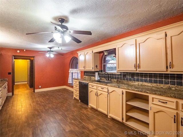 kitchen with dark wood-type flooring, a sink, baseboards, backsplash, and dishwasher