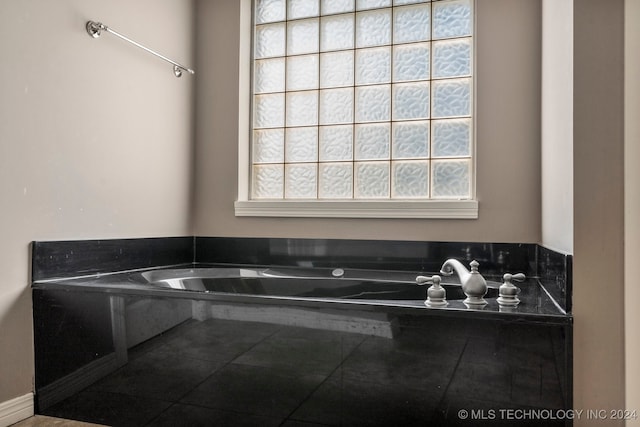 bathroom featuring a washtub