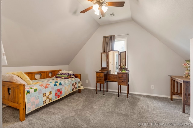 carpeted bedroom with ceiling fan and vaulted ceiling