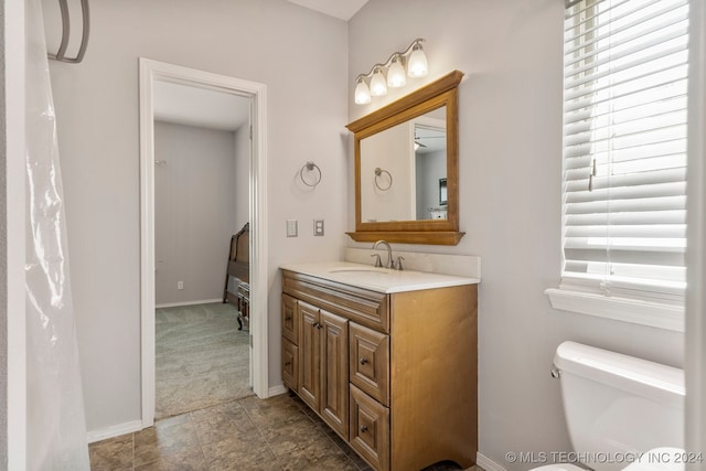 bathroom with vanity and toilet