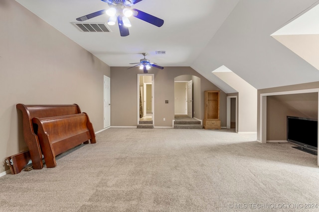 bonus room with lofted ceiling, light colored carpet, and ceiling fan