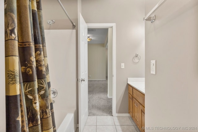 bathroom featuring vanity, shower / tub combo, and tile patterned floors