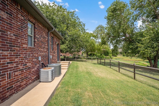 view of yard featuring central AC unit