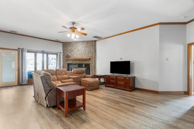 living room featuring light wood-type flooring and ornamental molding