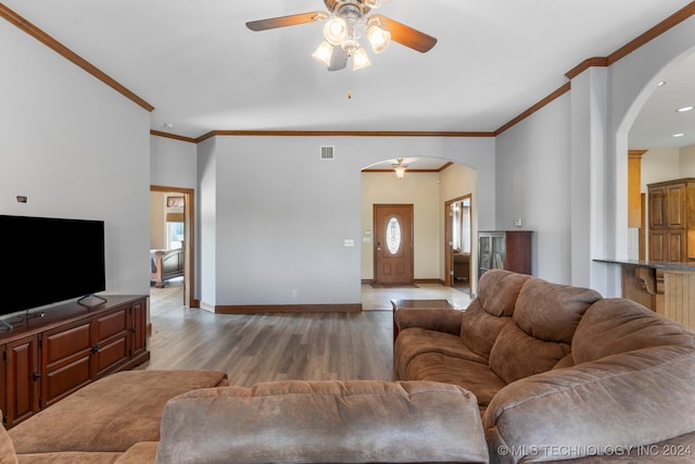 living room with ornamental molding, ceiling fan, and hardwood / wood-style floors