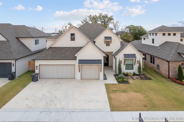 view of front facade featuring a front yard and a garage