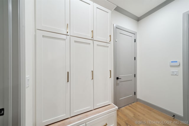 mudroom with light hardwood / wood-style floors