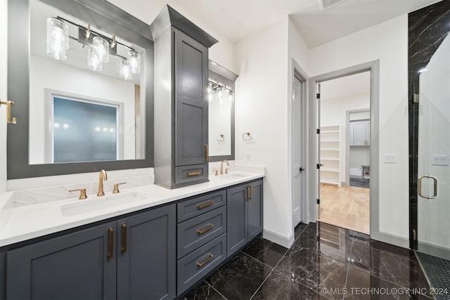 bathroom featuring vanity and an enclosed shower