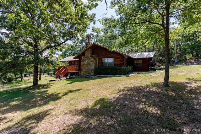 view of side of home featuring a yard