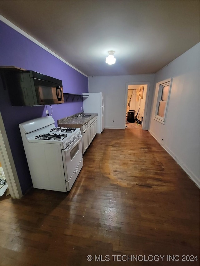 kitchen with white range with gas stovetop, white cabinets, and dark hardwood / wood-style flooring