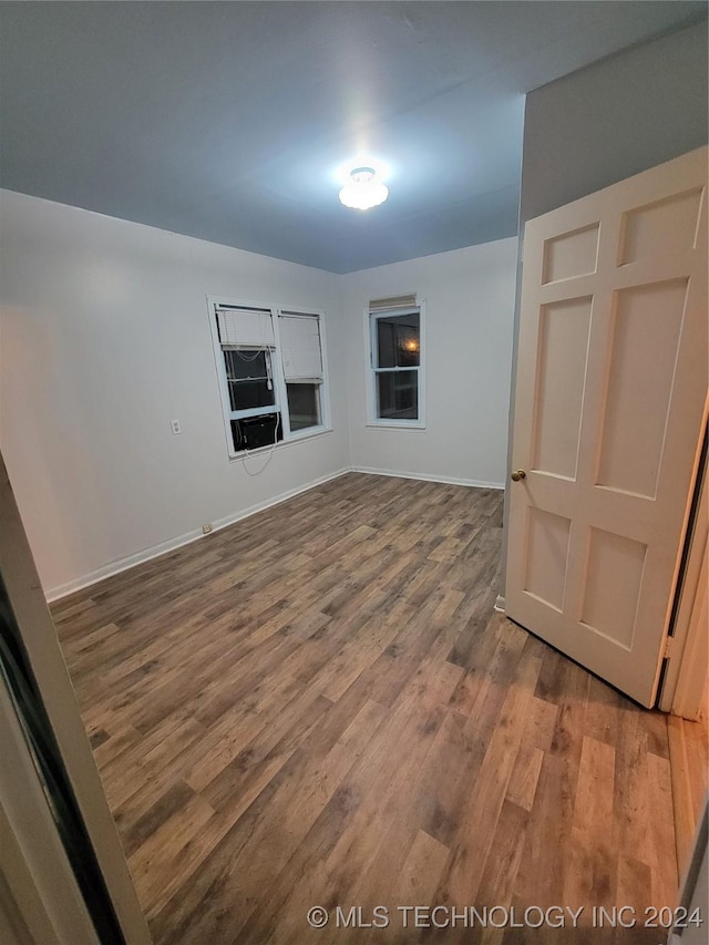 spare room featuring hardwood / wood-style floors