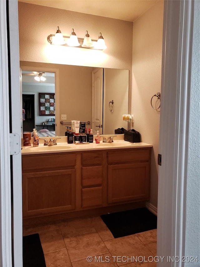 bathroom with tile patterned flooring and vanity