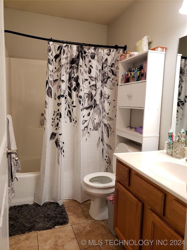 full bathroom featuring shower / bath combo, vanity, tile patterned floors, and toilet