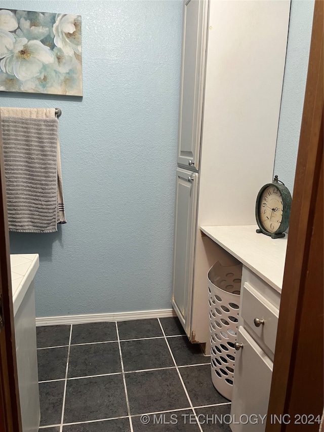 bathroom with tile patterned flooring