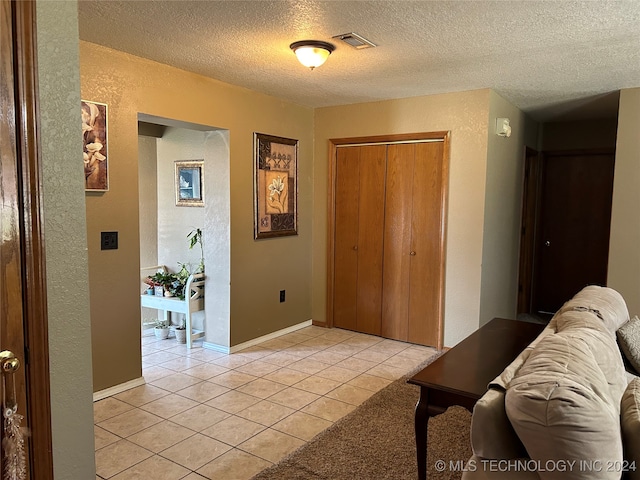 interior space featuring a textured ceiling