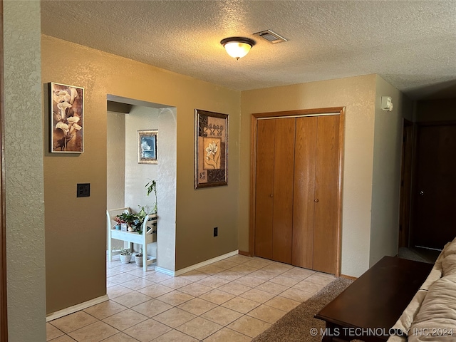 interior space with a textured ceiling