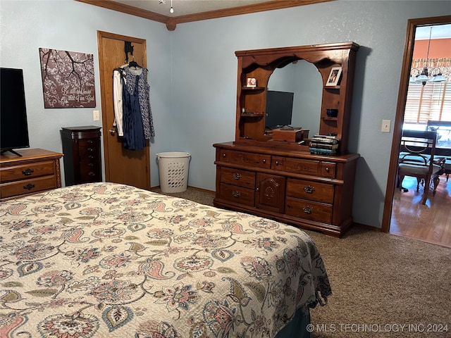 carpeted bedroom with crown molding