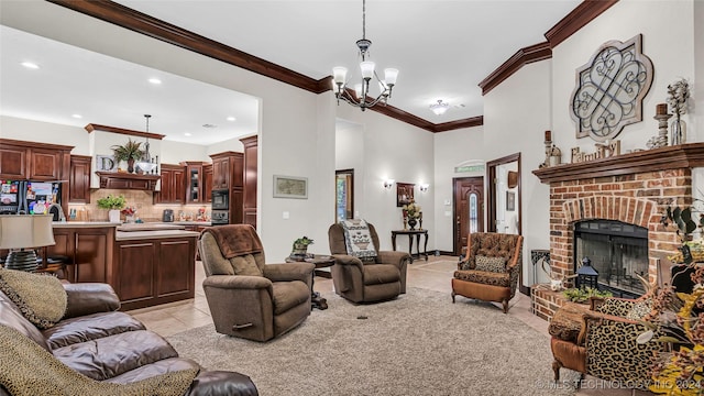 living room with light tile patterned floors, crown molding, a fireplace, and a chandelier