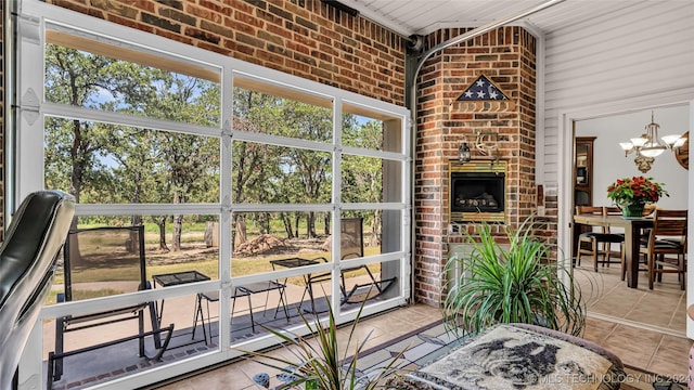 sunroom with a notable chandelier