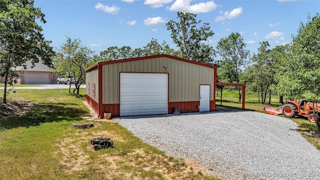 garage featuring a yard