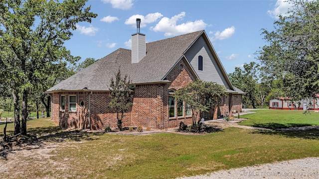 view of side of property featuring a yard