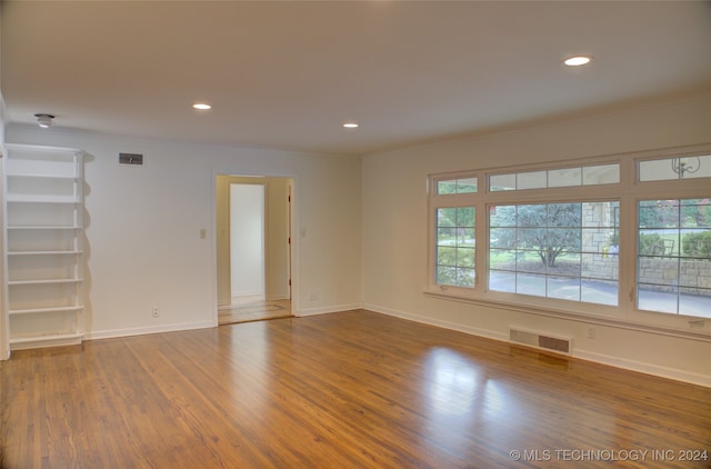 spare room featuring hardwood / wood-style floors